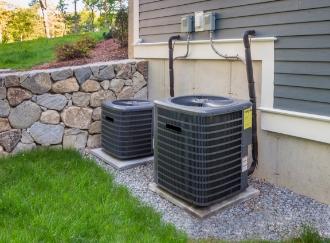 photo of 2 AC units in a suburban lawn