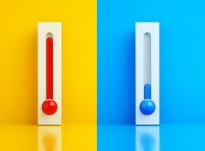 two thermometers side by side, one is hot and one is cold