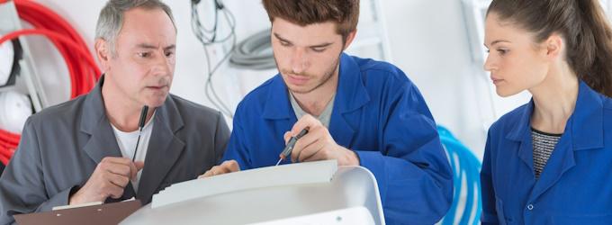 an instructor training two hvac technicians