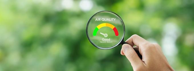 magnifying glass with air quality graphics