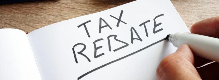 Notebook page with the words "Tax Rebate" written in bold letters