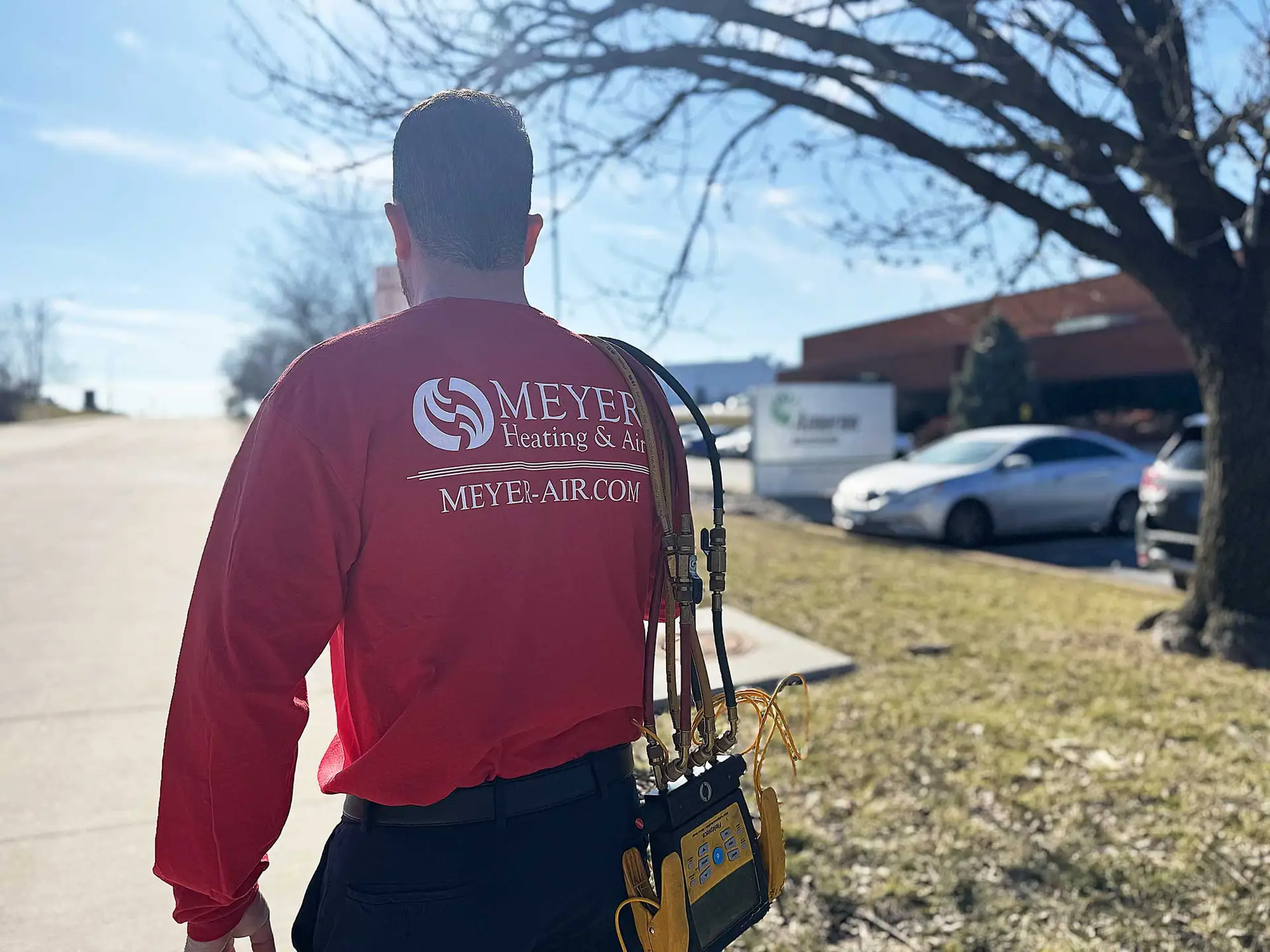 Meyer Heating & Air technician arriving at a service call