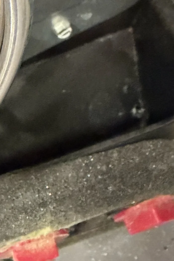 Condensate drain pan before an antimicrobial treatment tab is placed