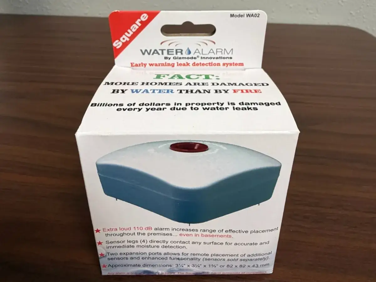 Water alarm leak detector installed at the floor drain